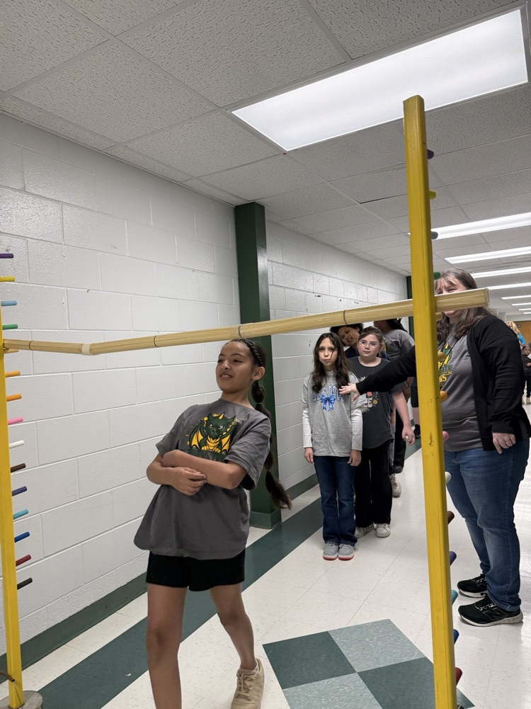 female student participating in limbo