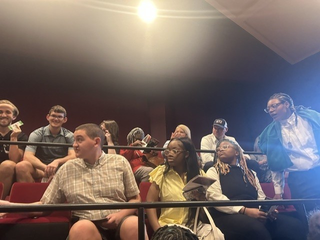 Students in theater seats.