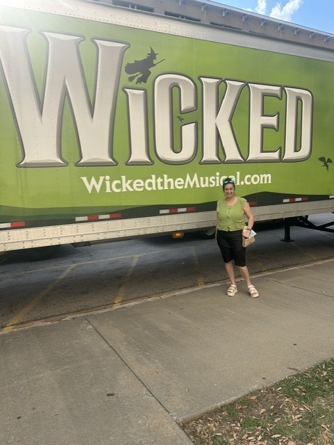 Wicked Truck with Teacher standing in Front.