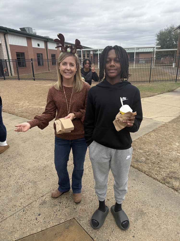 woman posing with student outside 
