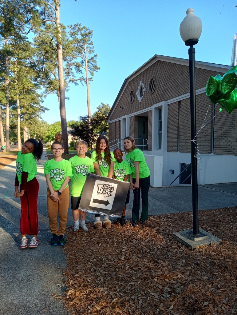 six children standing in front of a church on their way to the Battle of the Books