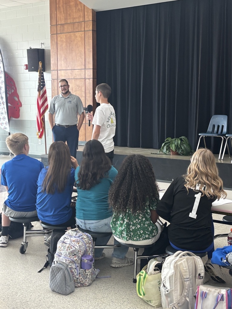 Student asking guest speaker a question.