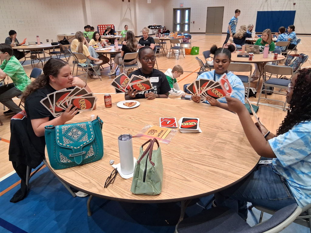 Bookmaster team playing UNO during a break. 