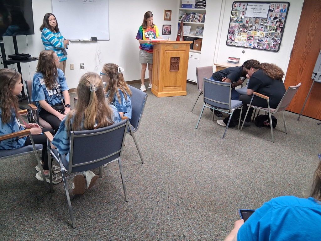 Bookmasters team discussing the answer during a competition.