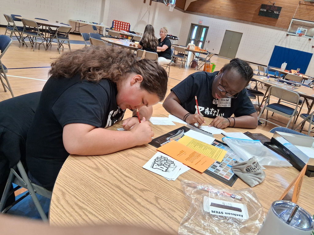Competition  team writing thank you notes to sponsors.