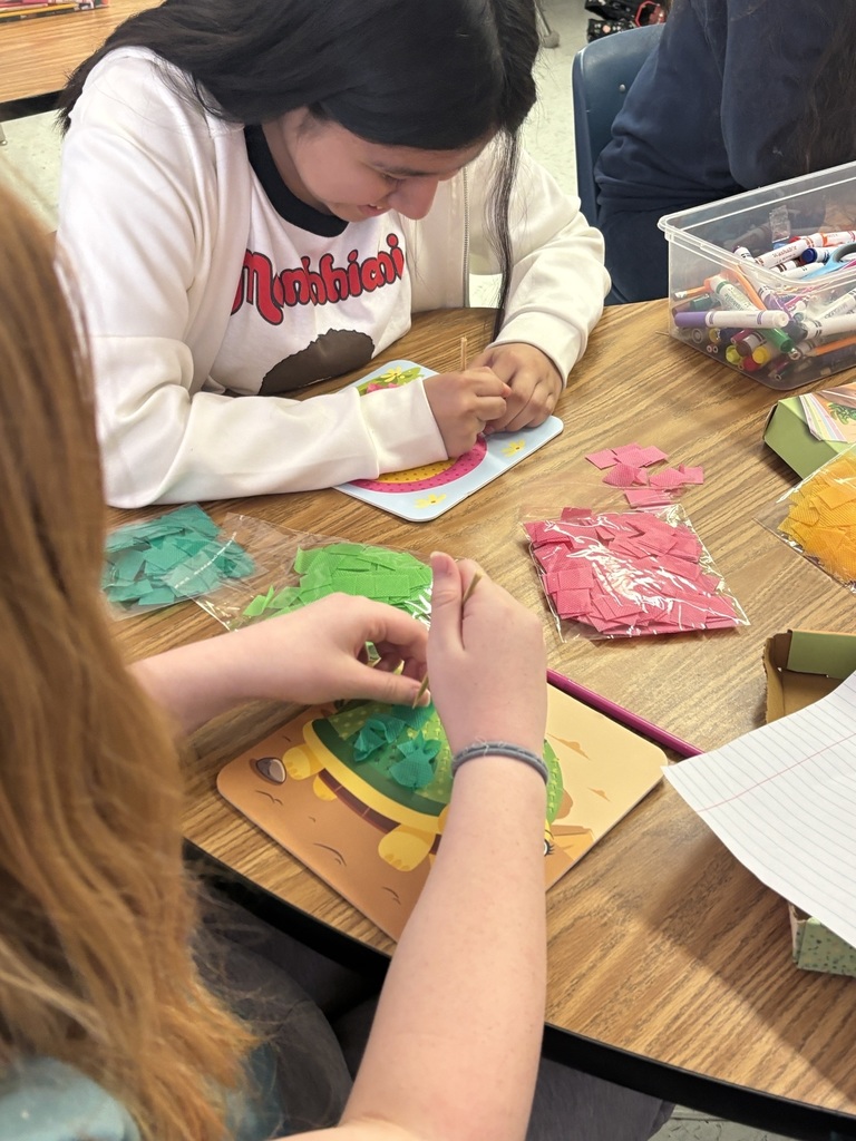 Students creating poke art.