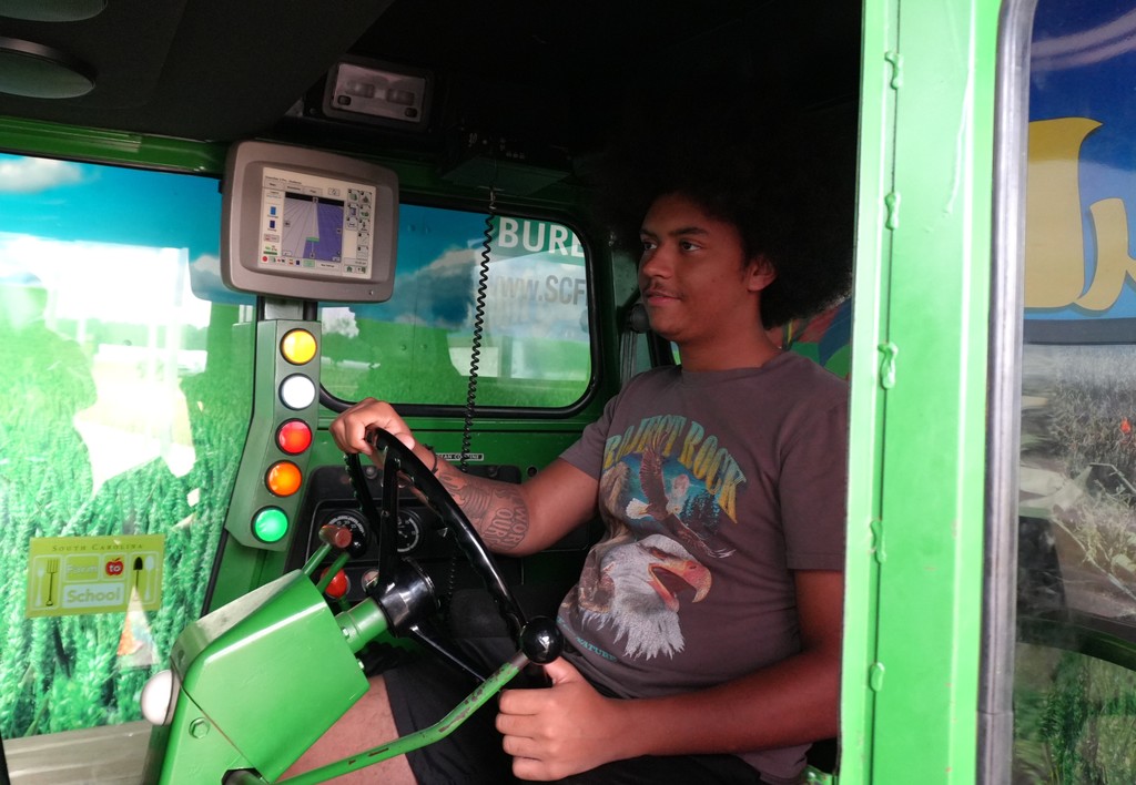 Student sitting in tractor.