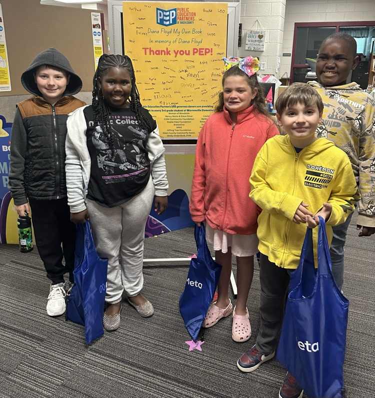 Students with books purchased with money gifted from PEP. 