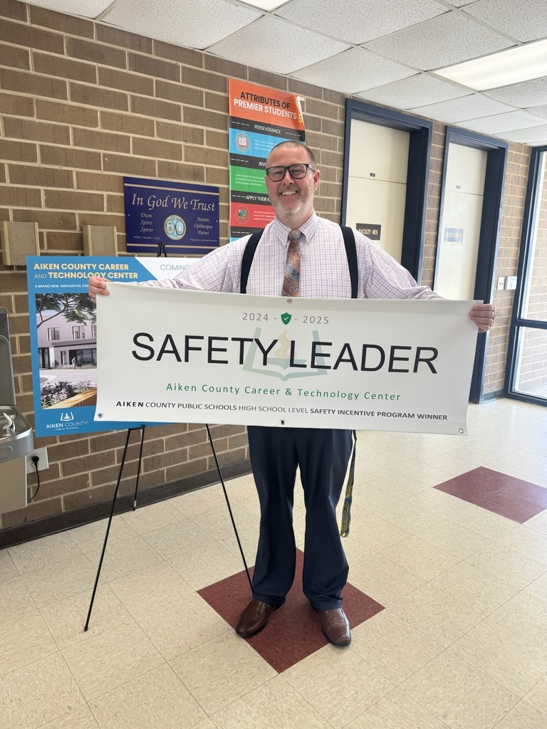 Mr. Harris from Aiken County Career and Technology Center holding a Safety Leader Banner.