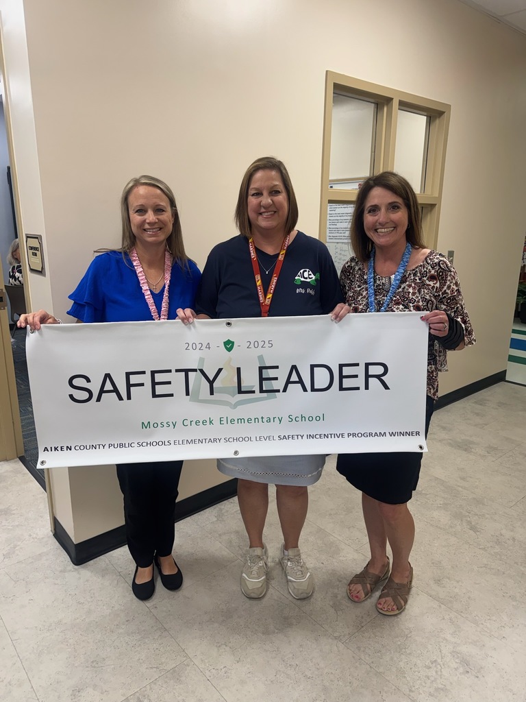 Administrators from Mossy Creek Elementary School holding a Safety Leader Banner.