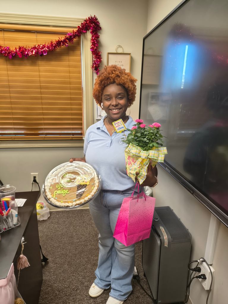 Administrative Assistant Paige Alexander receiving her celebration gifts for Admin Assistant Day.