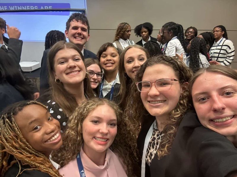 Students posing at convention. 
