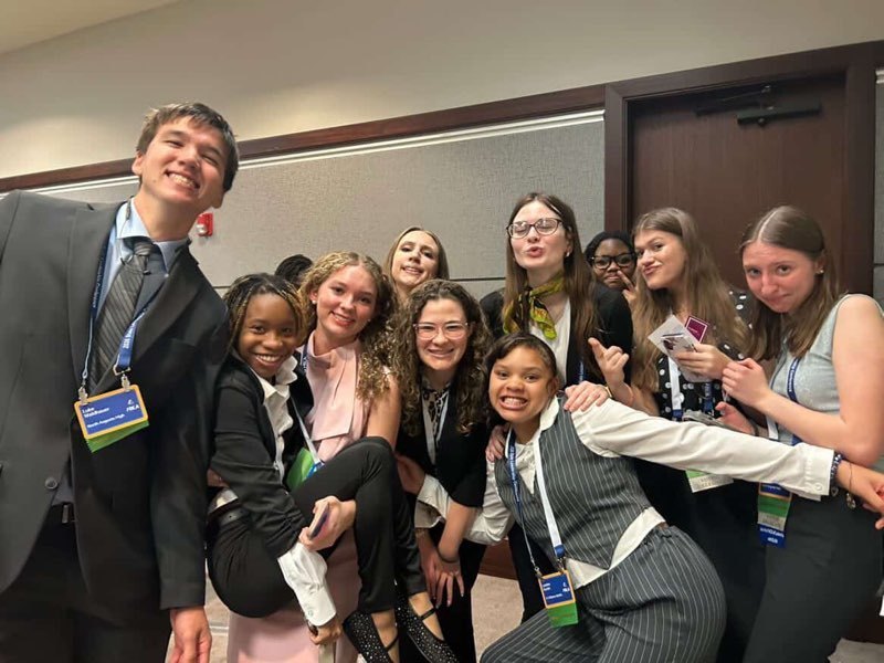 Students posing at convention. 