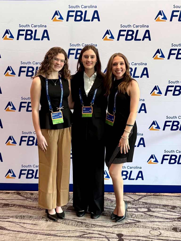 Students posing at convention. 