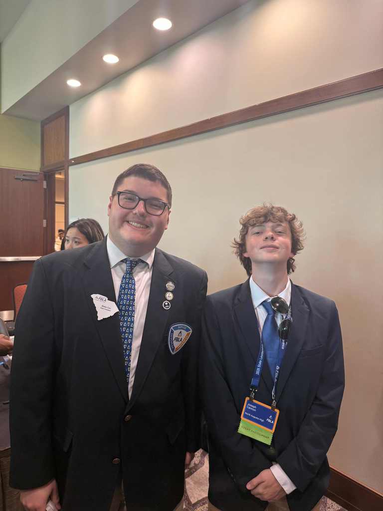 Students posing at convention. 