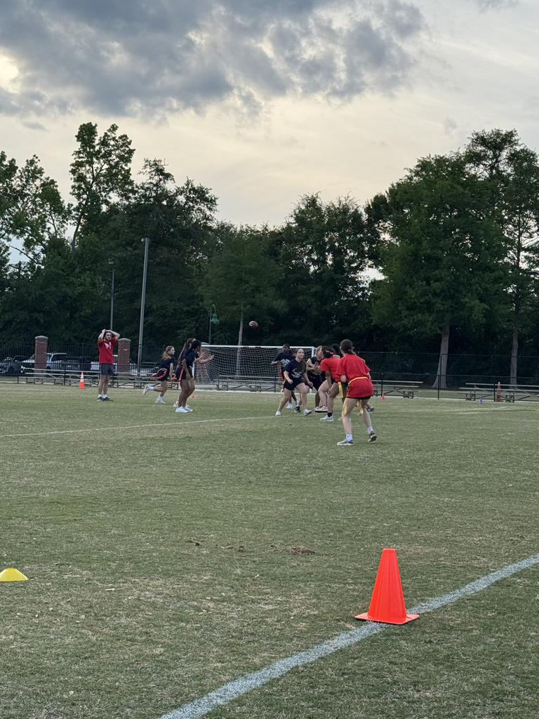 students playing powderpuff football