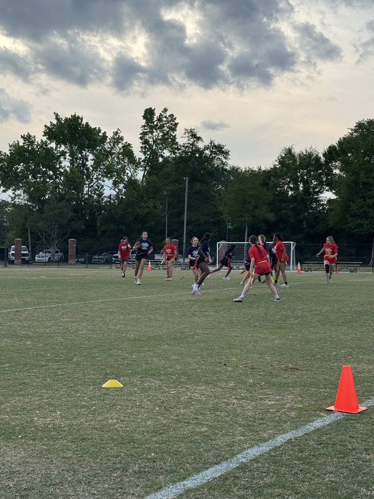 students playing powderpuff football
