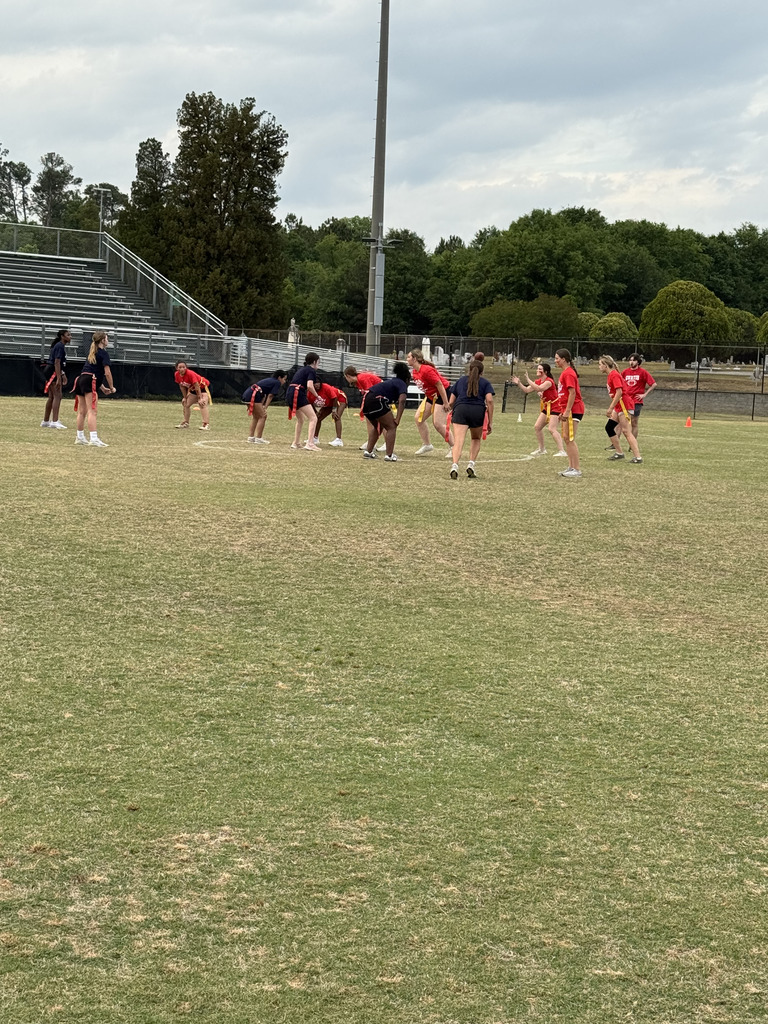 students playing powderpuff football