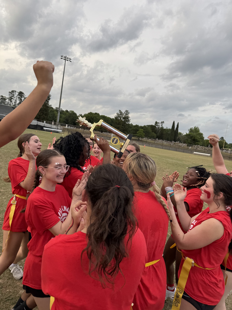 students holding up trophy