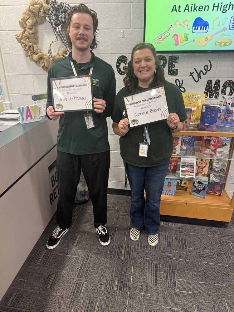 picture of two people posing for a picture with certificates 