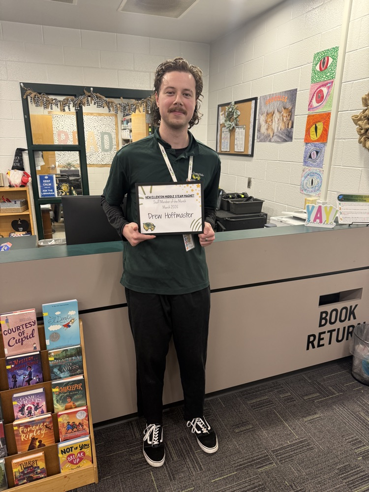 picture of a man holding a certificate and posing 