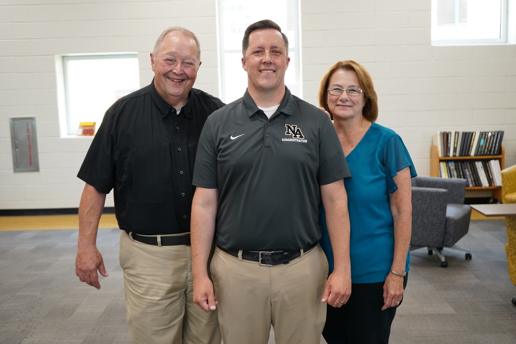 Principal with Mom and Dad in Library. 