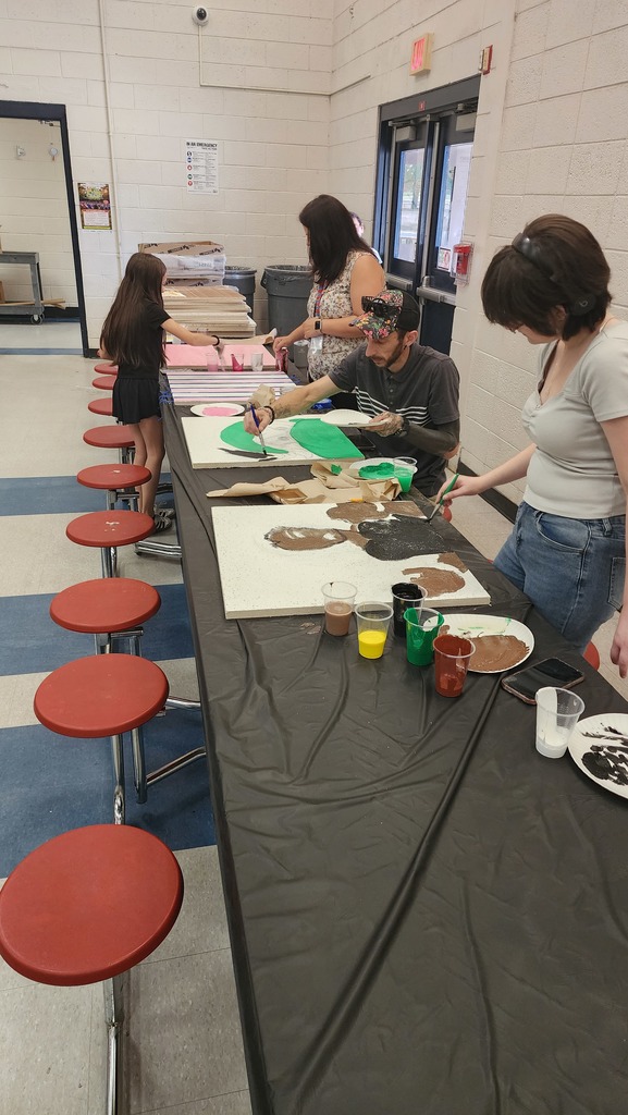 people painting ceiling tiles