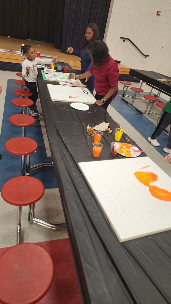 people painting ceiling tiles