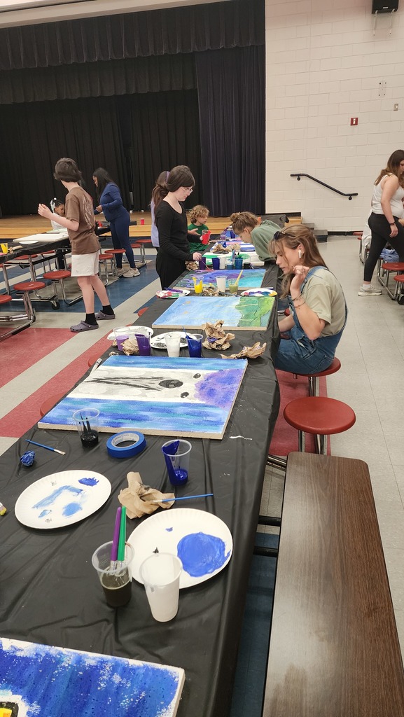 people painting ceiling tiles