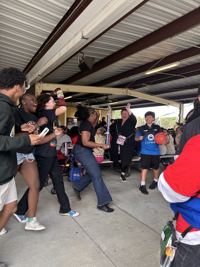 students and teachers celebrating 1st place trophy
