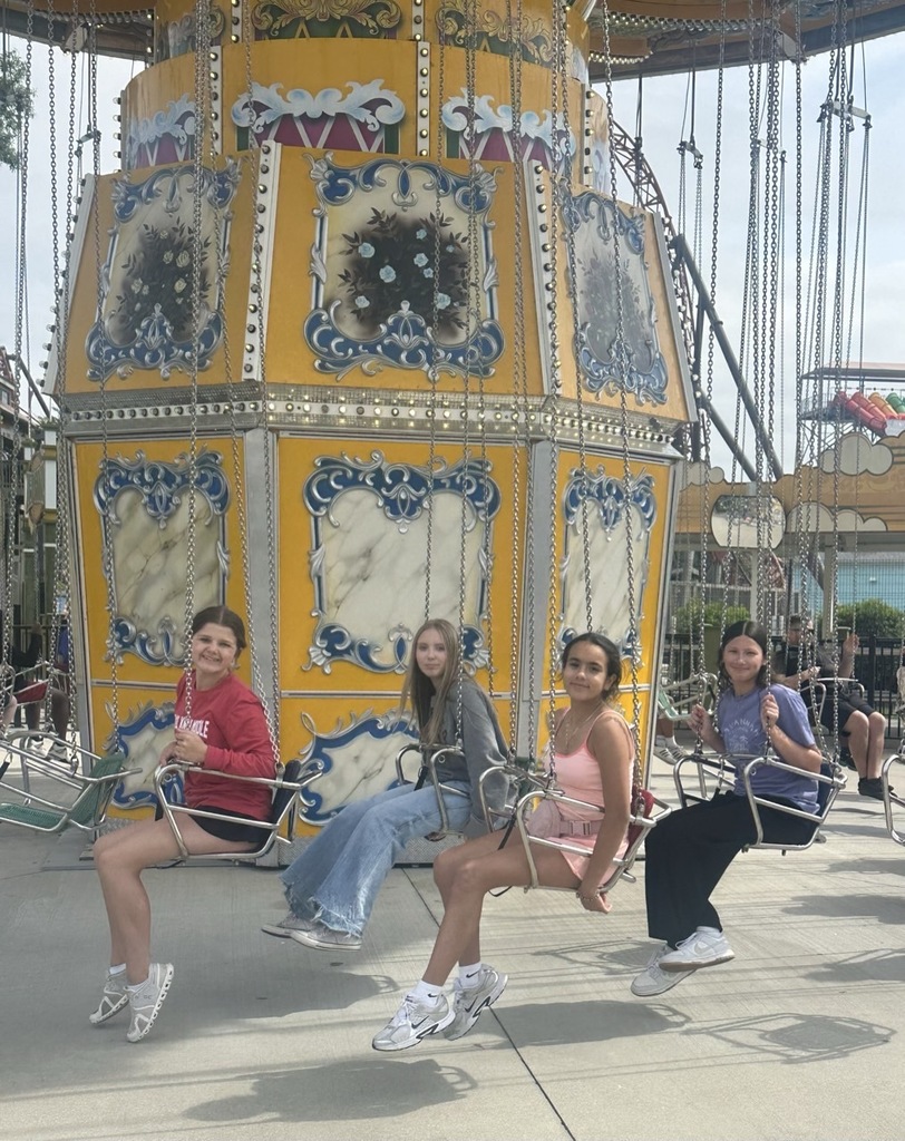 students on swings at carowinds