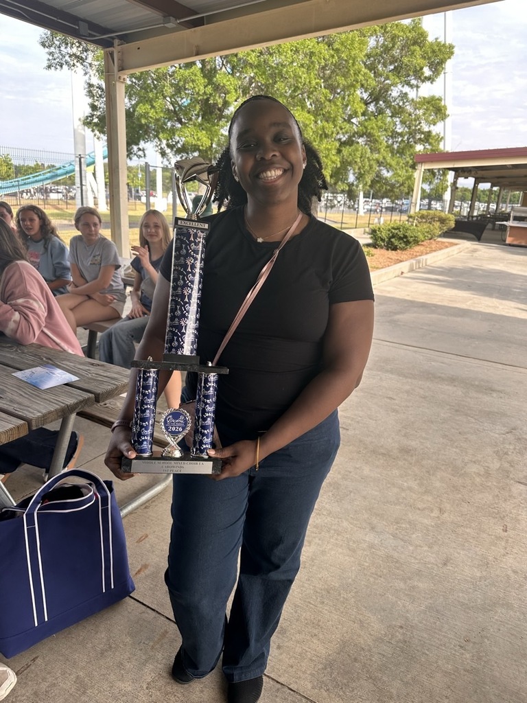 Mrs. Purcell holding the 1st place trophy