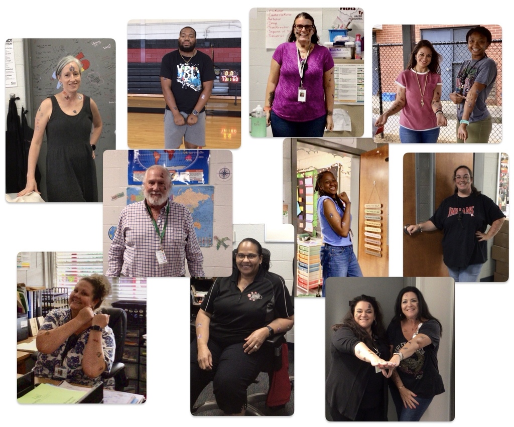 Staff sporting temporary tattoos for a good cause.