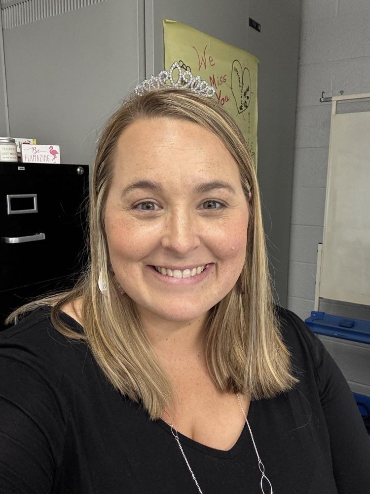 teacher wearing a crown/tiara