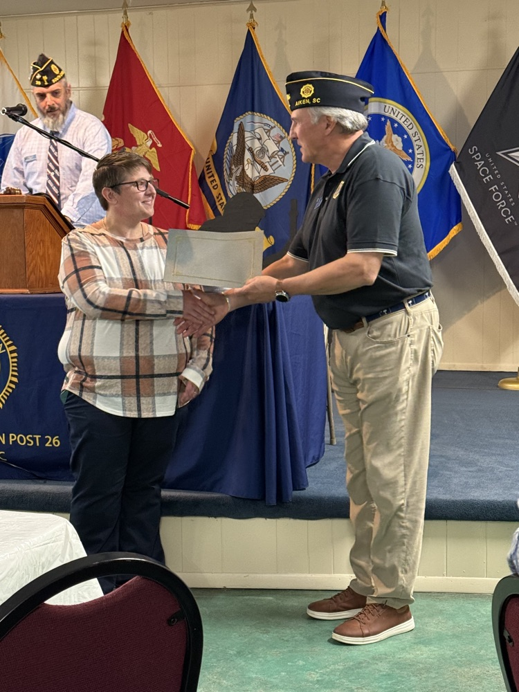 teacher receiving certificate 