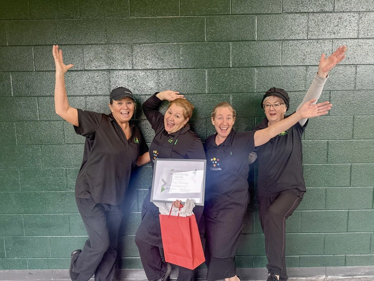 cafeteria staff posing for a picture 