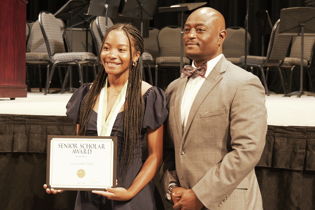 Dr. Murphy poses with student.