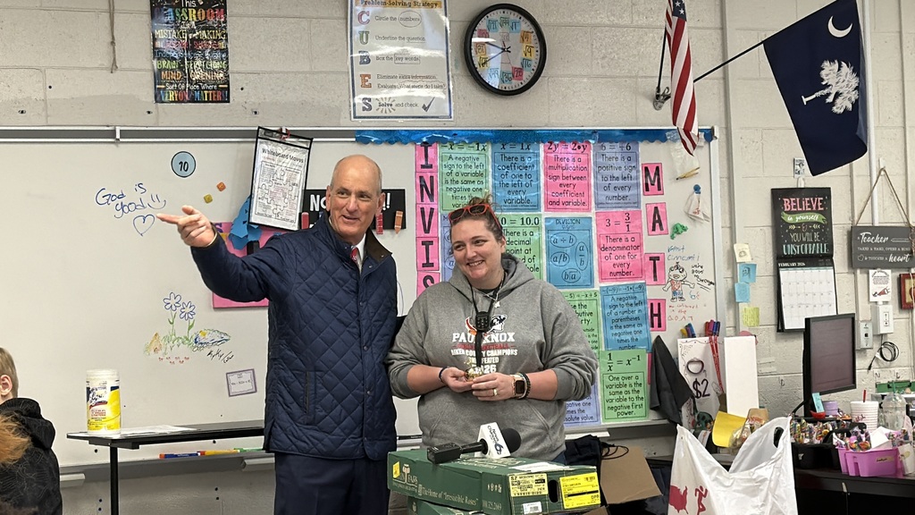 Heather Parliament of Paul Knox Middle receives a Golden Apple Award.