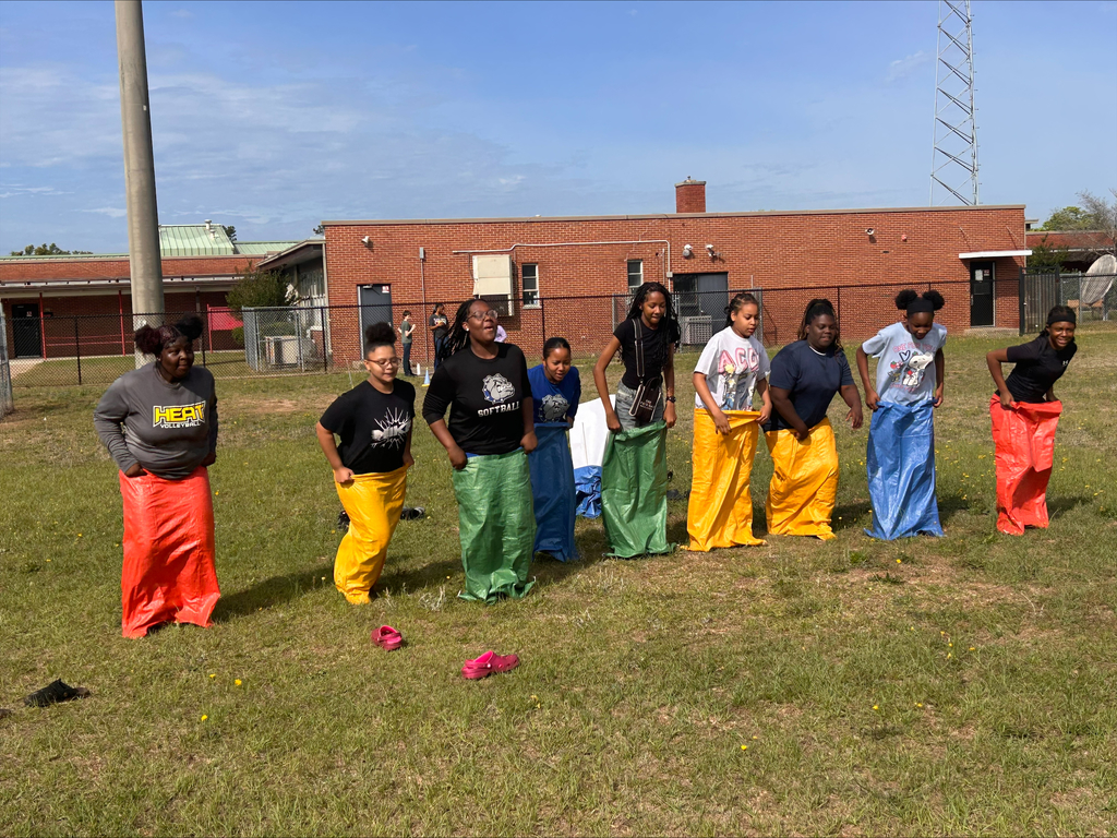 Students competing in sack race.