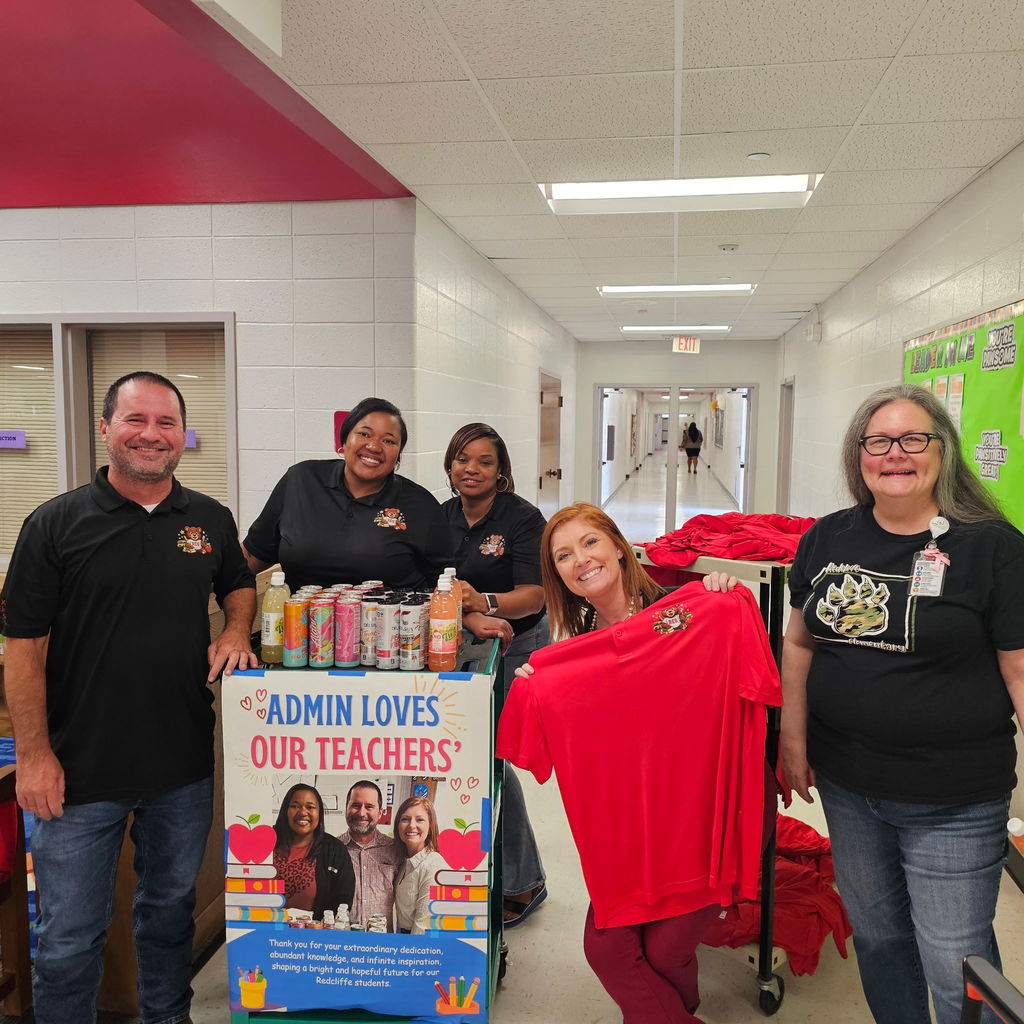 Administration team with snack cart and shirts to hand out.