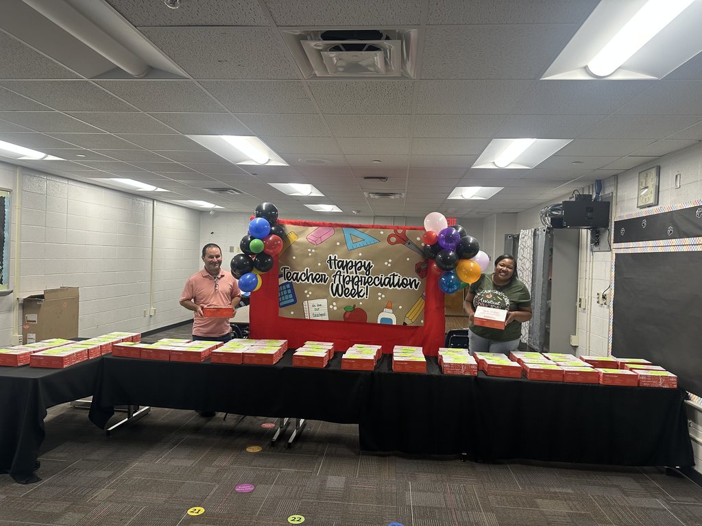 Administration team with boxes of food.
