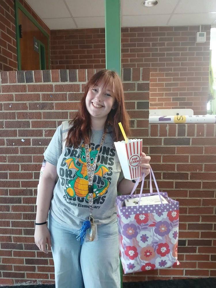 teacher holding a funny cup