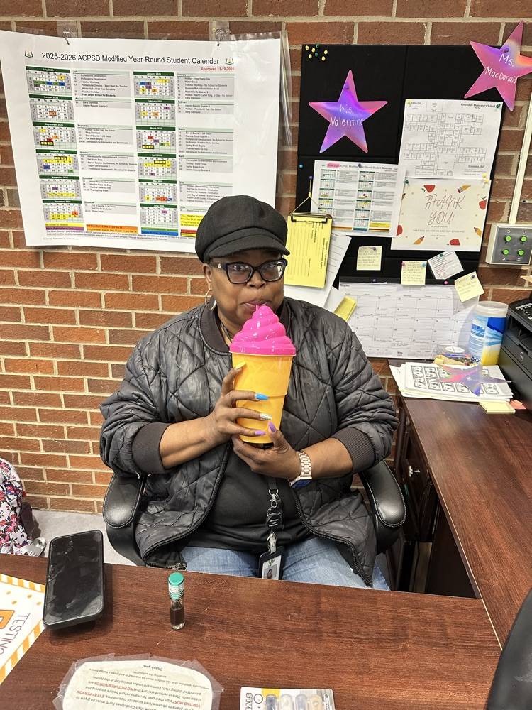 teacher holding a funny cup