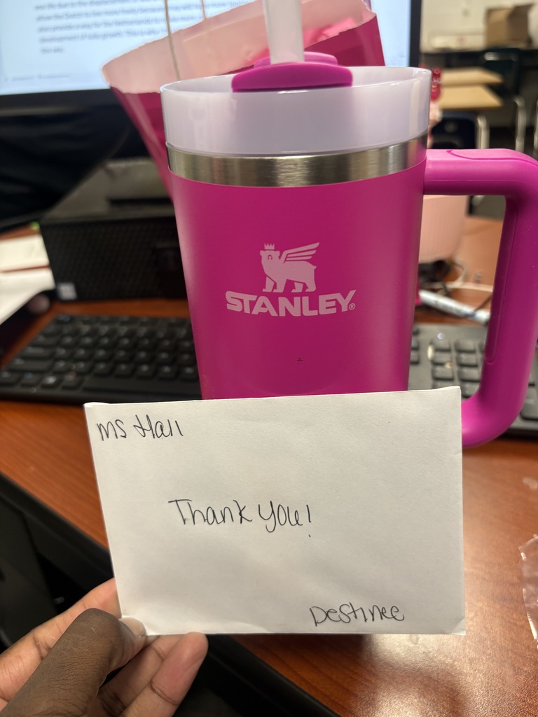 gift card in front of a cup 