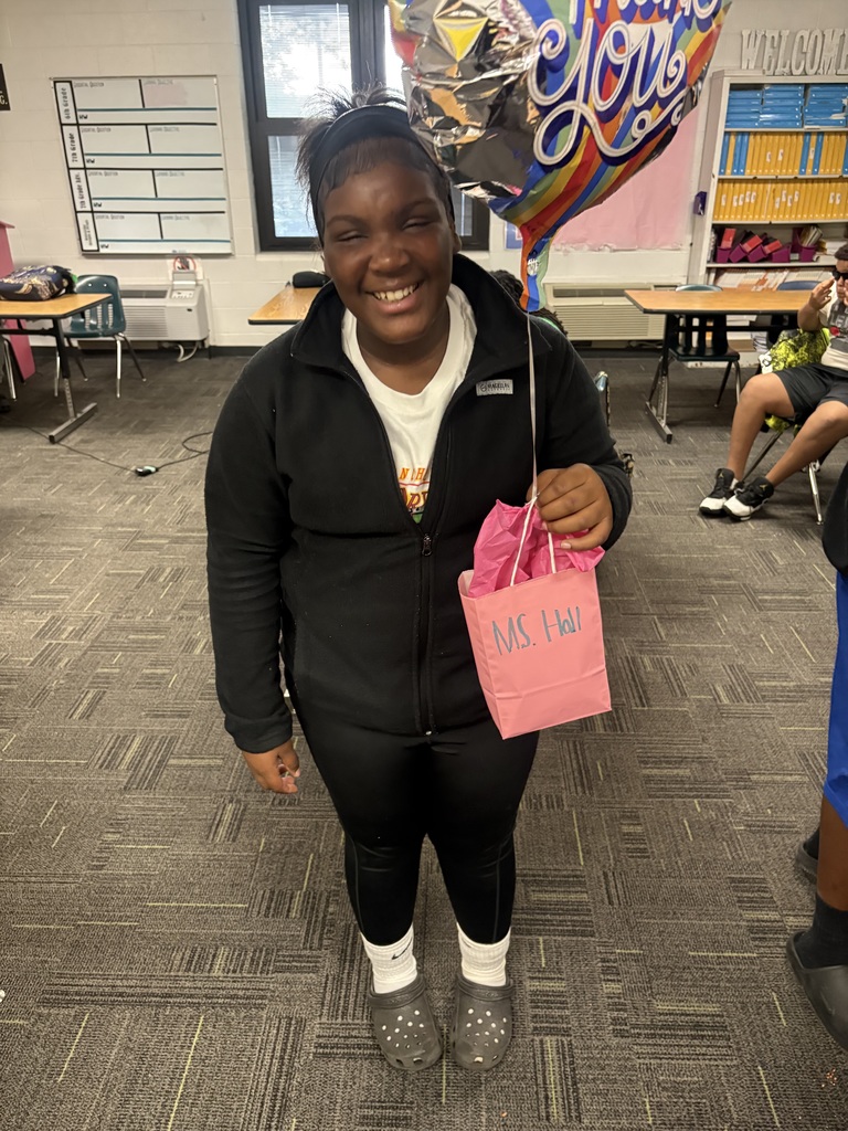 student holding a gift bag