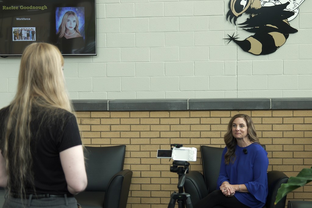 Tracy photographed being interviewed.