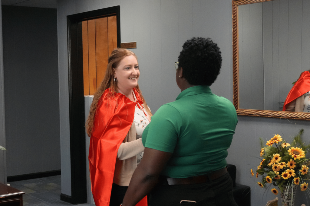 Hiring event attendee shaking hands with interviewer.