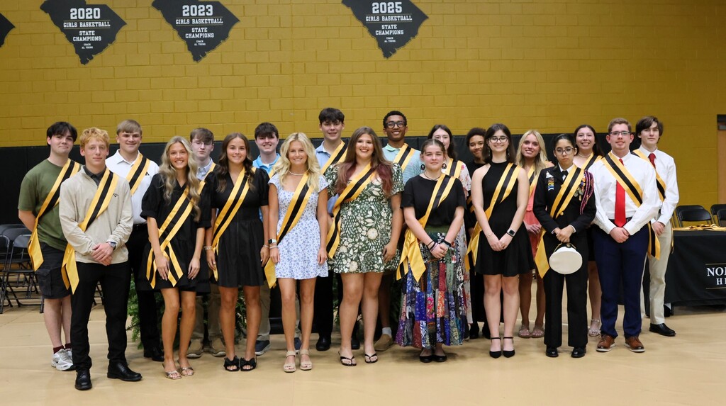 A group of 20 students with sashes representing Junior Marshalls.
