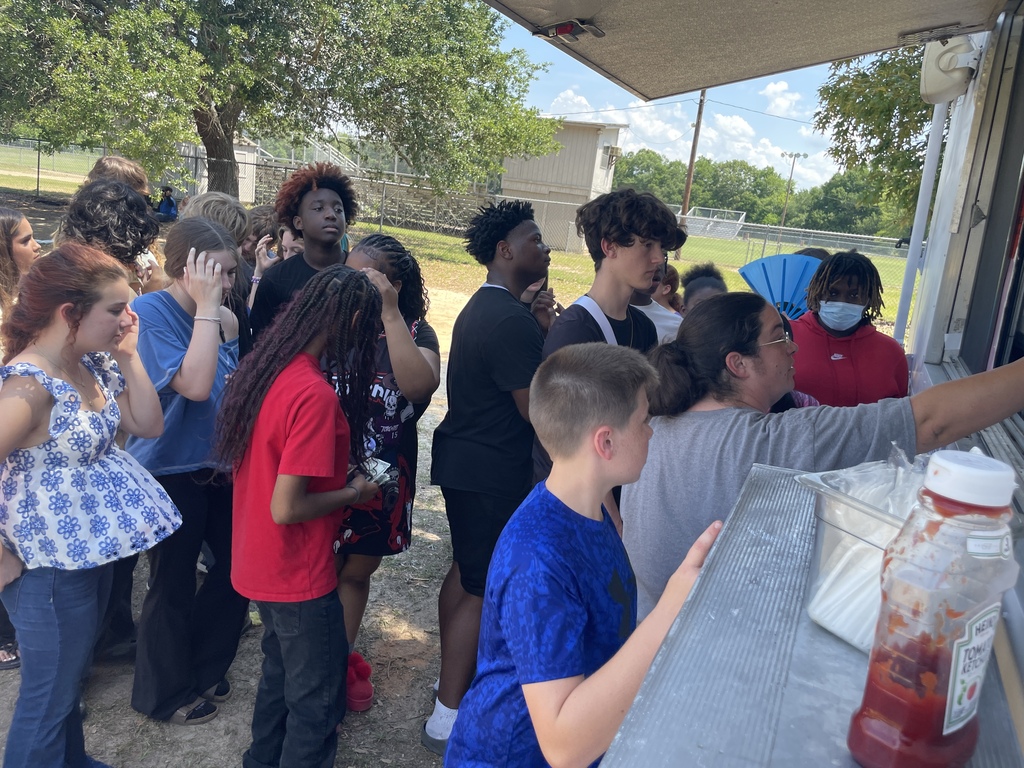 Students ordering lunch from food truck.