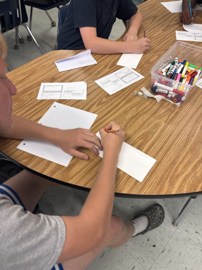 AVID students addressing envelopes.